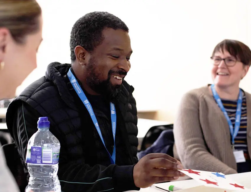 Student and staff in class session