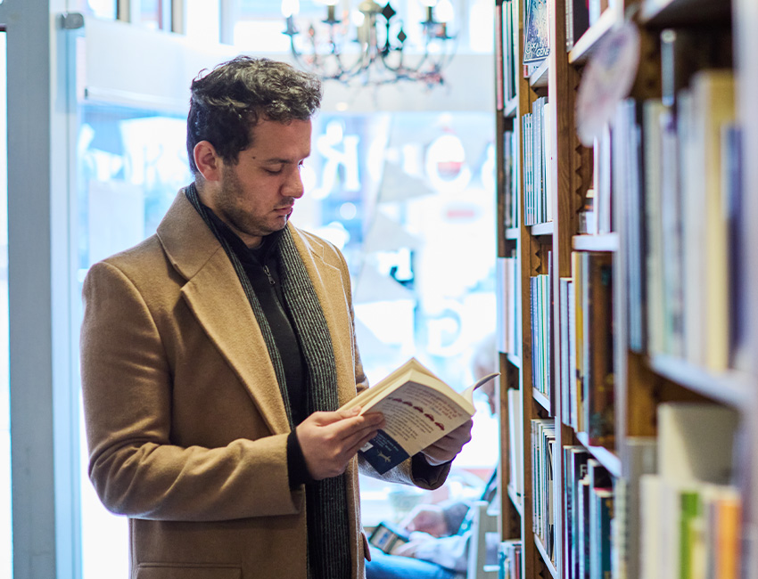 A student browsing books at a local bookshop