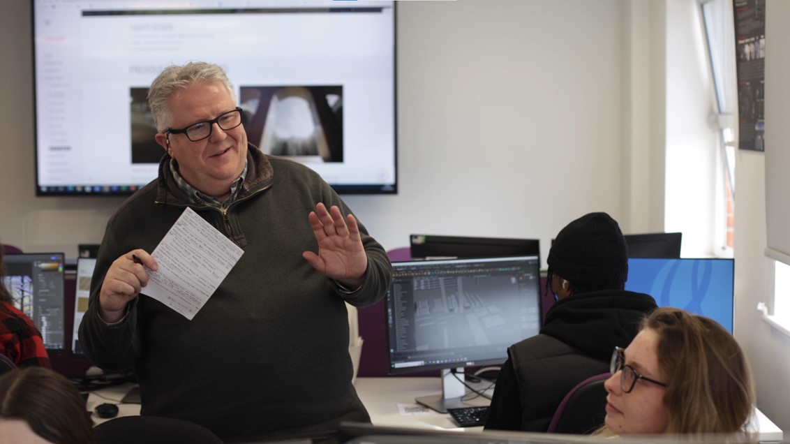 Game Art lecturer talking to a student