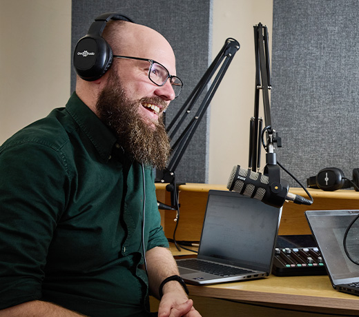 A radio broadcaster in a recording studio