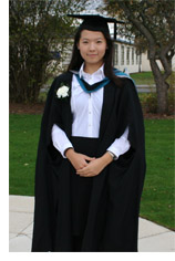 young chinese woman in graduation robes