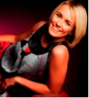 woman with a blonde bob lying at an angle