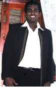 young man in a white shirt and black jacket