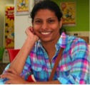 young smiling woman in a checked shirt