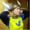 woman in a yellow top wearing a viking hat