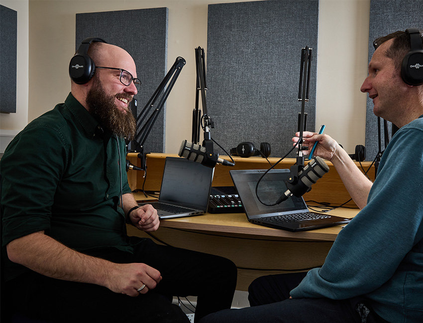 Students in podcast studio recording a discussion