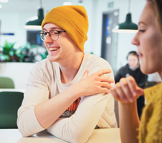 Students around a table studying together