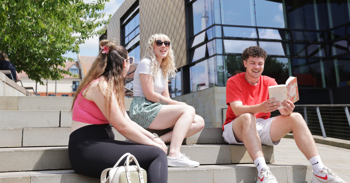 A group of students on the steps of the Hive library