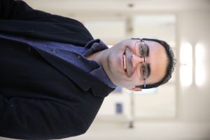 University of Worcester logo on a light blue background