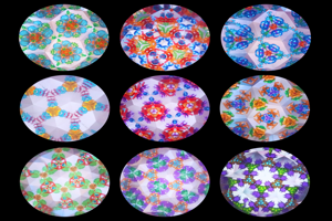 Nine circular kaleidoscope images of bright colourful abstract patterns arranged on a black background