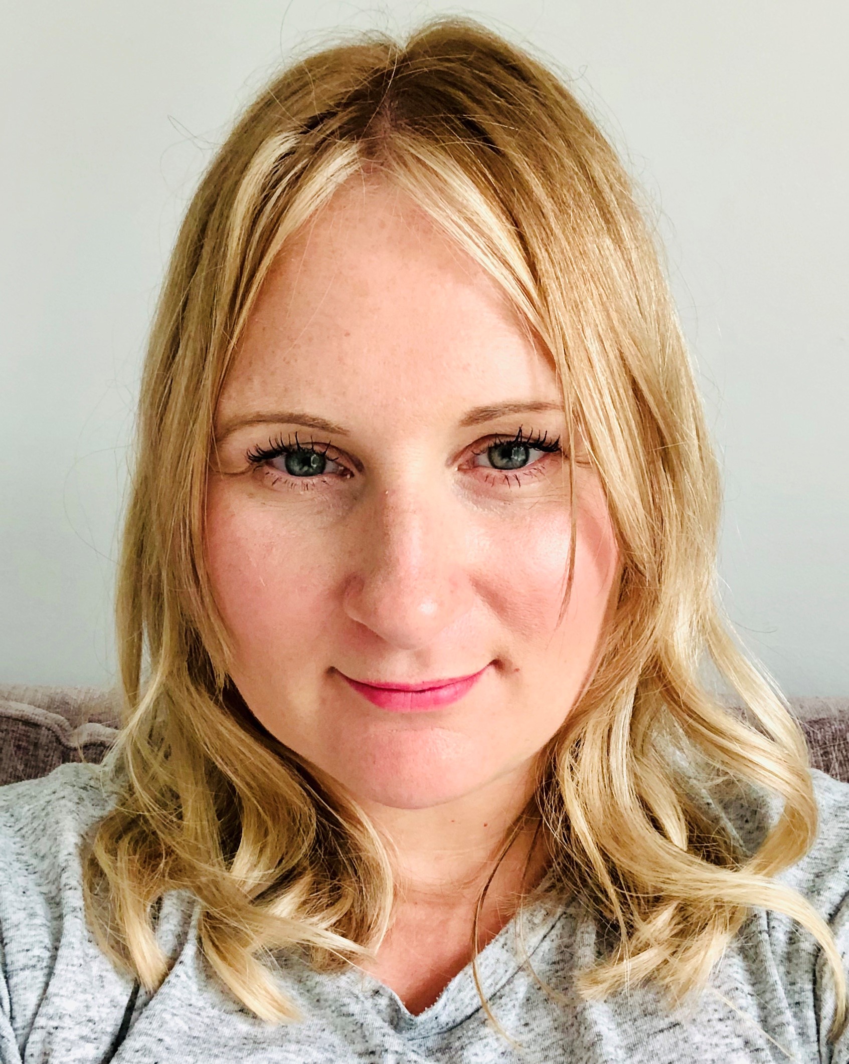 University of Worcester logo on a light blue background