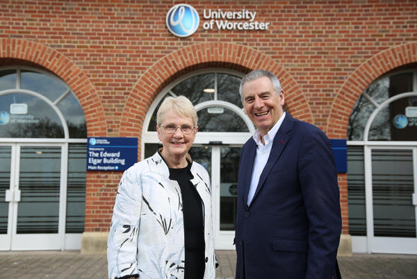 Mary Mahoney with Professor David Green outside the main University of Worcester building