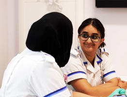Nursing students working together in simulation room