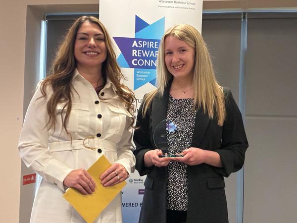 ARC Partner Michelle Banton with student Sophie Jew receiving an award