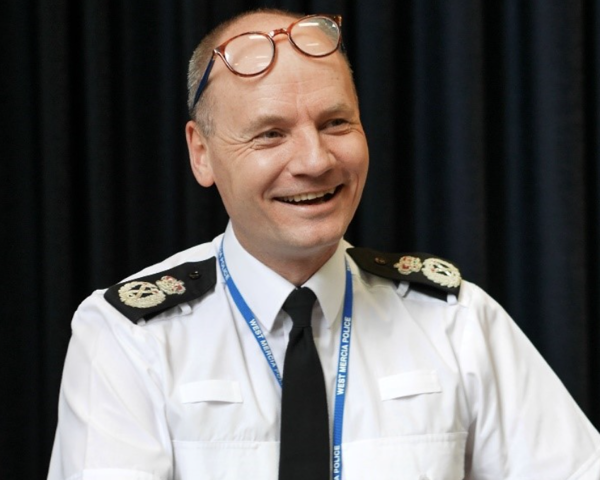 Head and shoulders shot of Alex Murray in his policing uniform