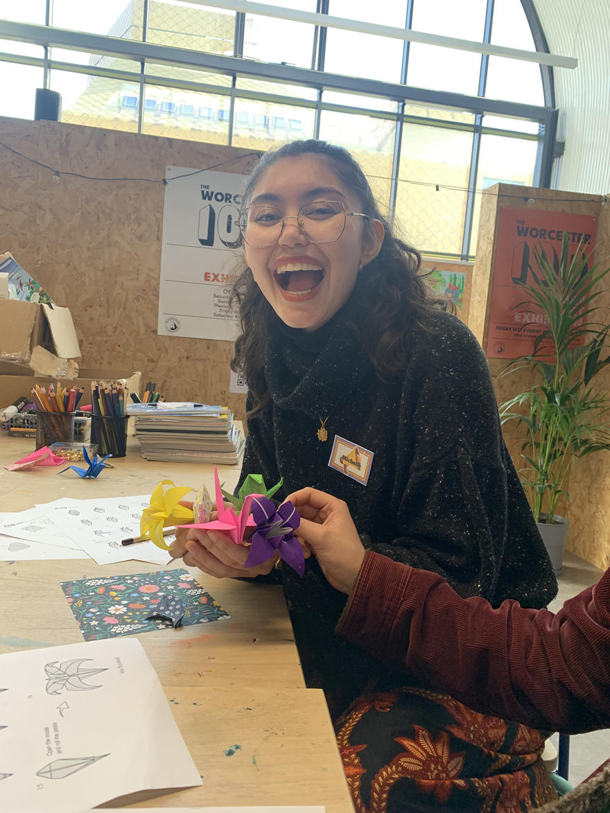 Michelle Turberfield smiles while doing art work