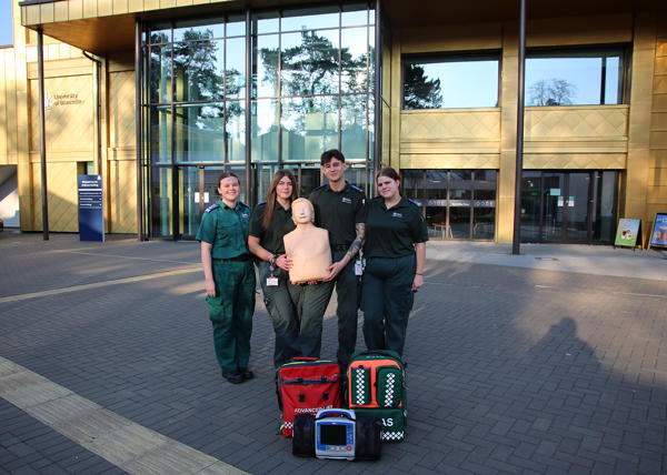 For members of the society pose with a rescuitation dummy outside the University's medical school