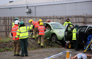 Firefighters work with student paramedics