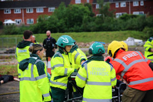 Paramedic students tend to a casualty on a stretcher