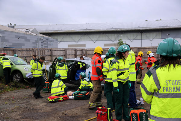 A shot of the simulation scene, with paramedics and firefighters at work