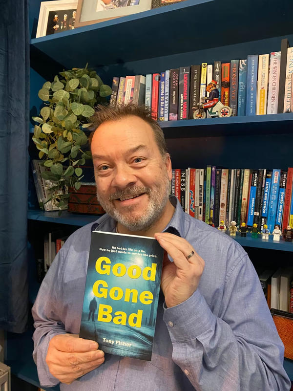 Tony Fisher poses with his book Good Gone Bad