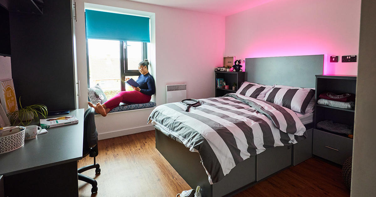 Student in their bedroom in halls