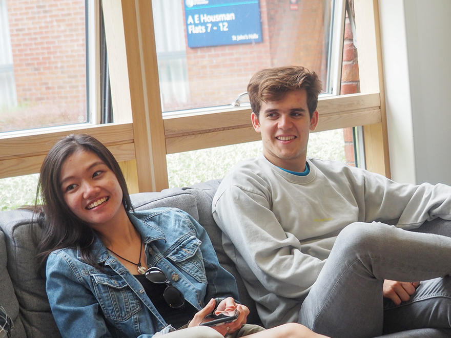 Two students on a sofa in student accommodation