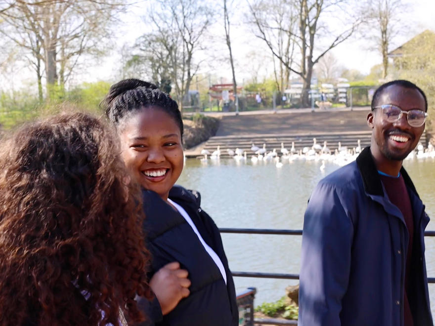 A group of students walking beside the River Severn