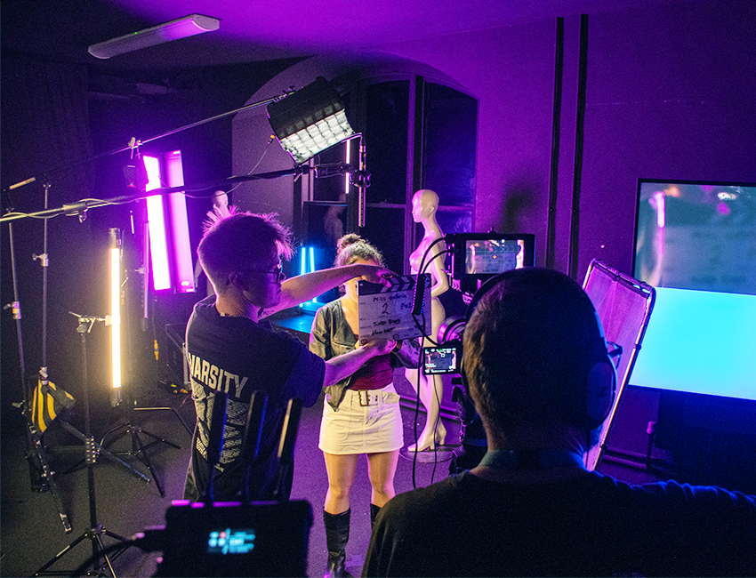 Student on a film set in a studio