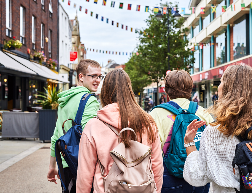 Students walking down Worcester highstreet