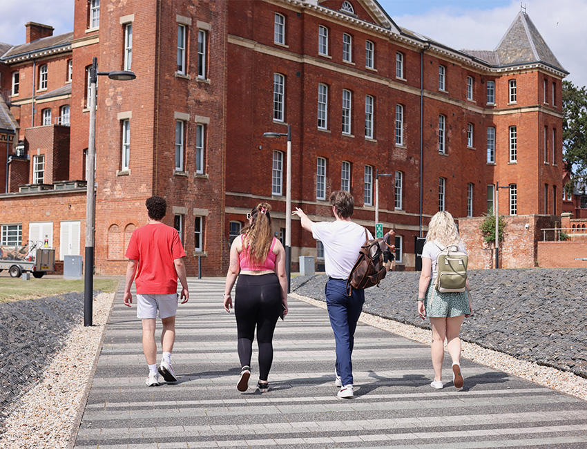 Students walking towards university building