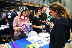 A student talking to another student about joining a society
