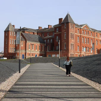 University of Worcester logo on a light blue background