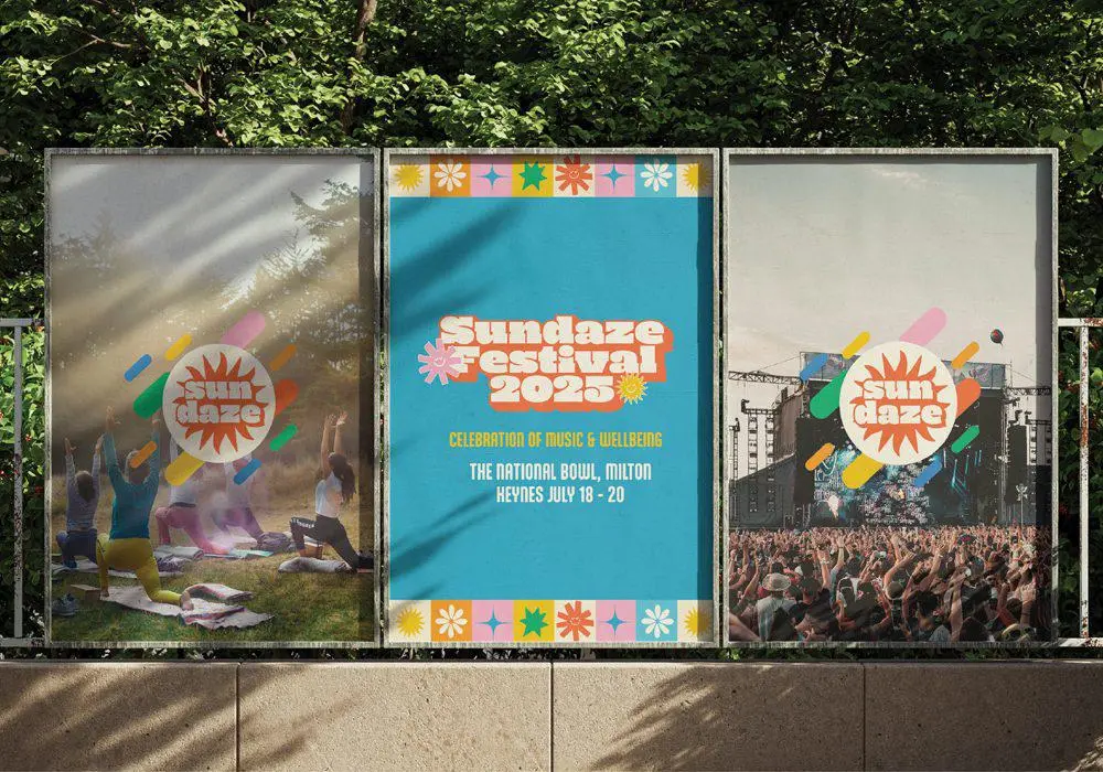 Three festival posters displayed outdoors, featuring yoga participants, a colorful Sundaze Festival 2025 announcement.