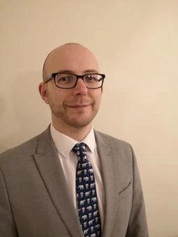 University of Worcester logo on a light blue background