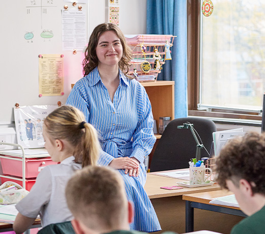 History teacher in a secondary school classroom