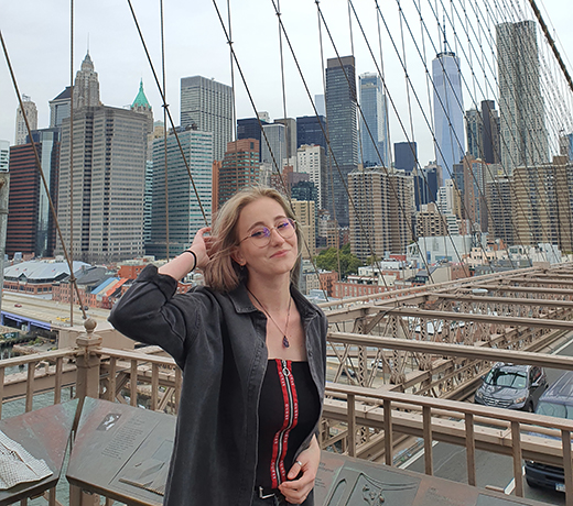 Student stood in front of the Brooklyn Bridge