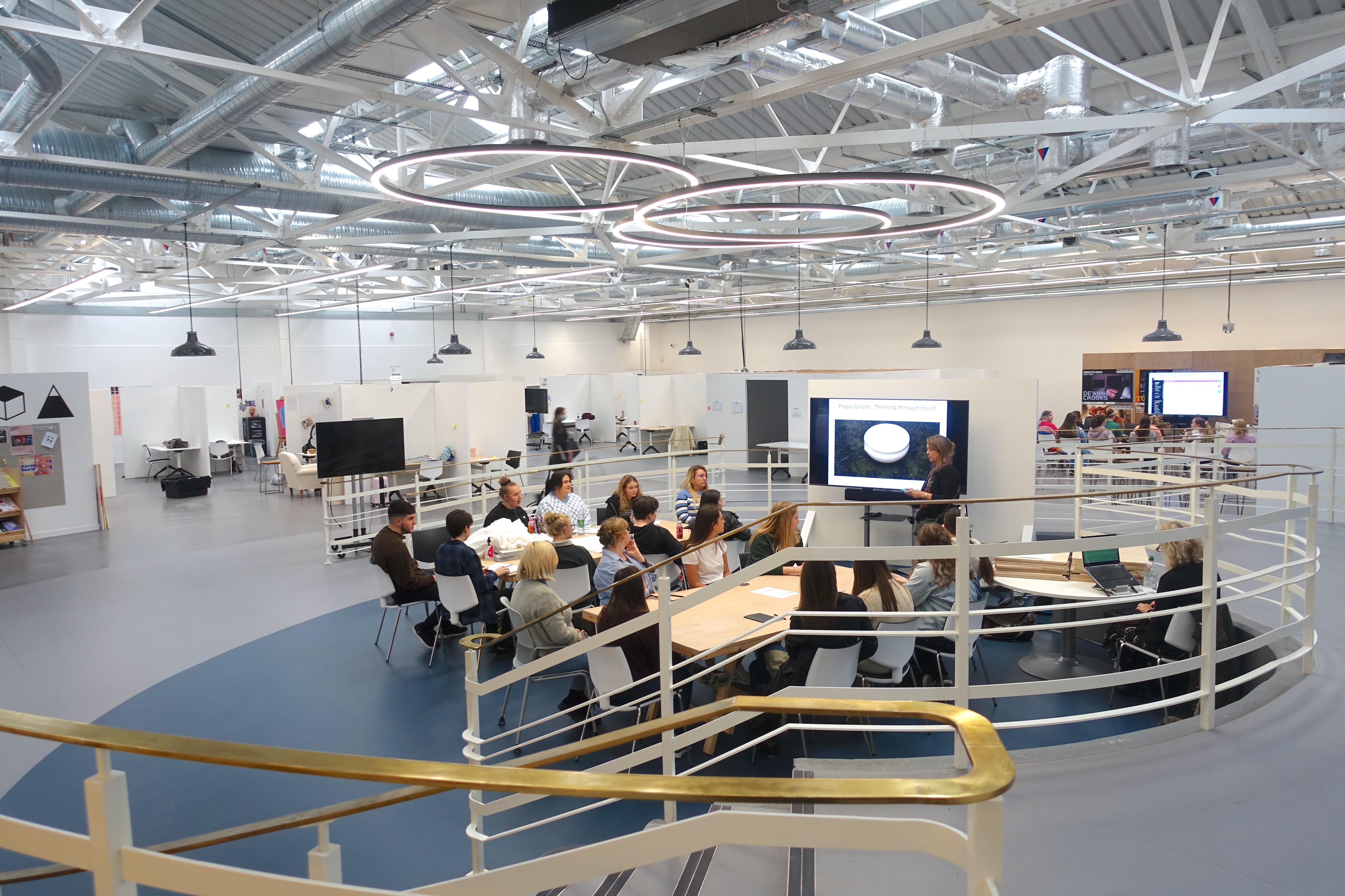 A group of students learning in the art house