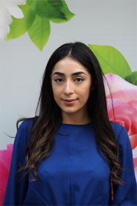 Ecem Komur a lady smiling