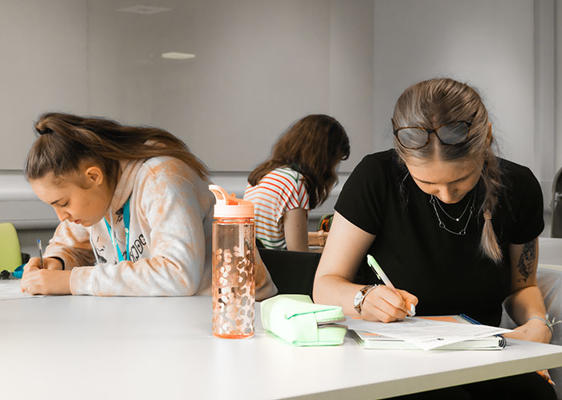 Two students studying at a table