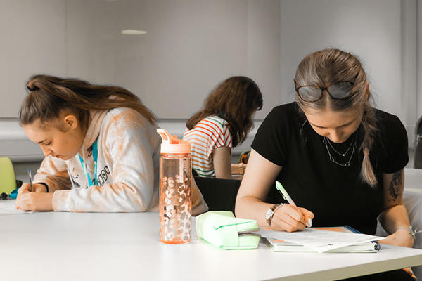 Two students studying at a table