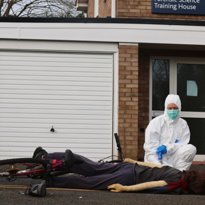 Forensic Scientist observing a crime scene