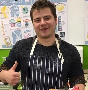 University of Worcester logo on a light blue background