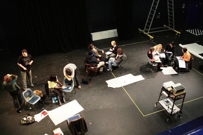 Looking down from the drama studio gallery on drama degree students preparing.