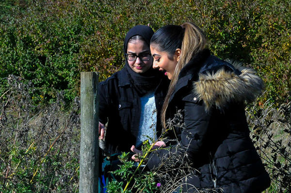 Two Early Childhood in Society students in the outdoors