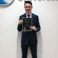 Jordan Smith holding certificate