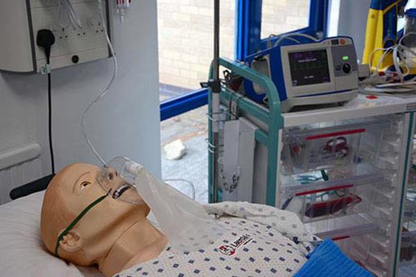 Sim man dummies lying in hospital bed in one of our nursing degree clinical skills rooms.