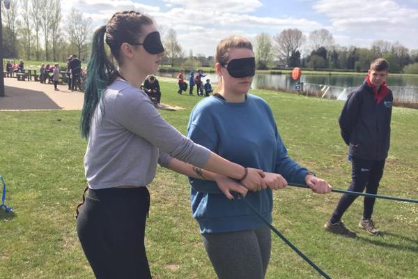 A group of Occupational Therapy students are performing a team building activity while blindfolded as part of our occupational therapy degree.