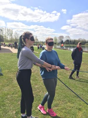 A group of Occupational Therapy students are performing a team building activity while blindfolded as part of our occupational therapy degree.