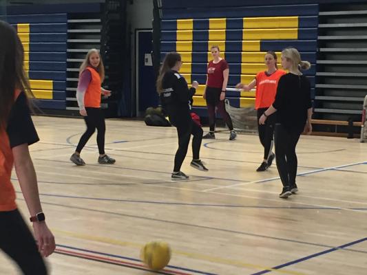A group of female Occupational Therapy trainees playing football as part of our occupational therapy degree.